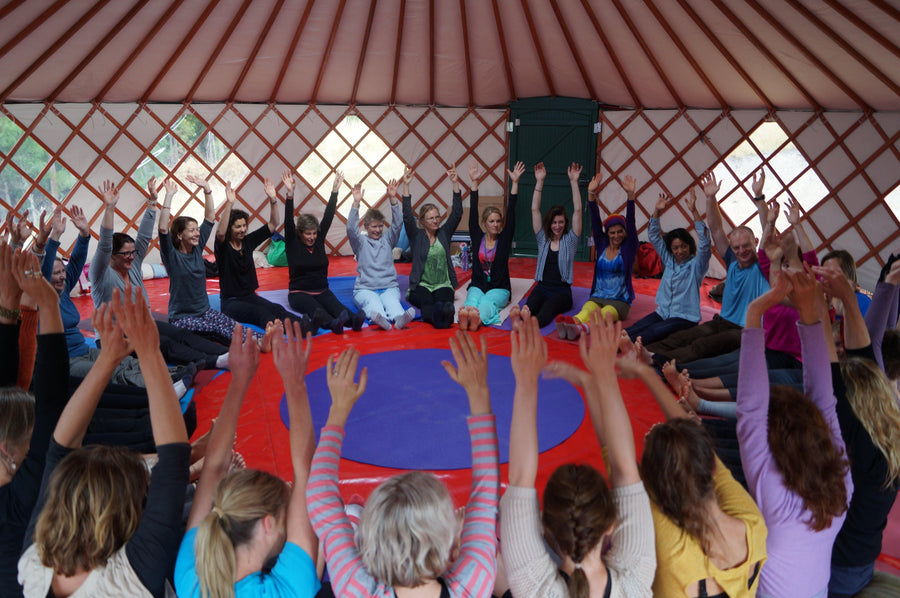 Rainbow Yoga teachers exploring advanced partner and group work