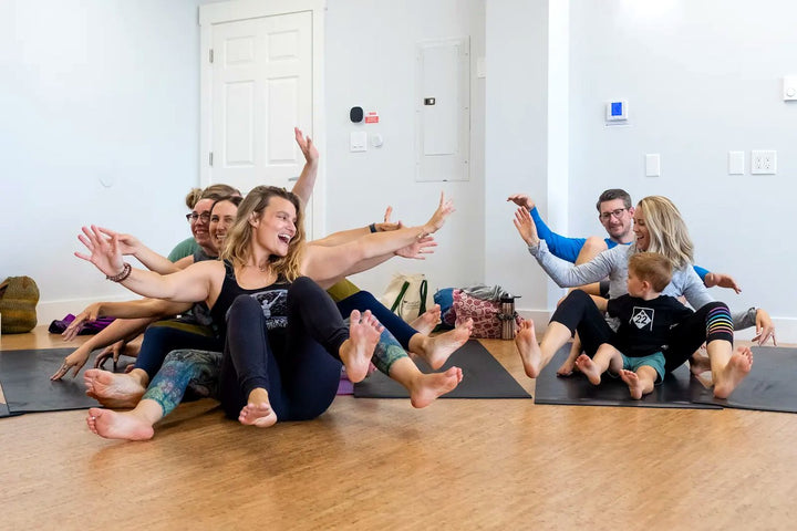 Adults learning through movement, play and cooperation at Rainbow Yoga