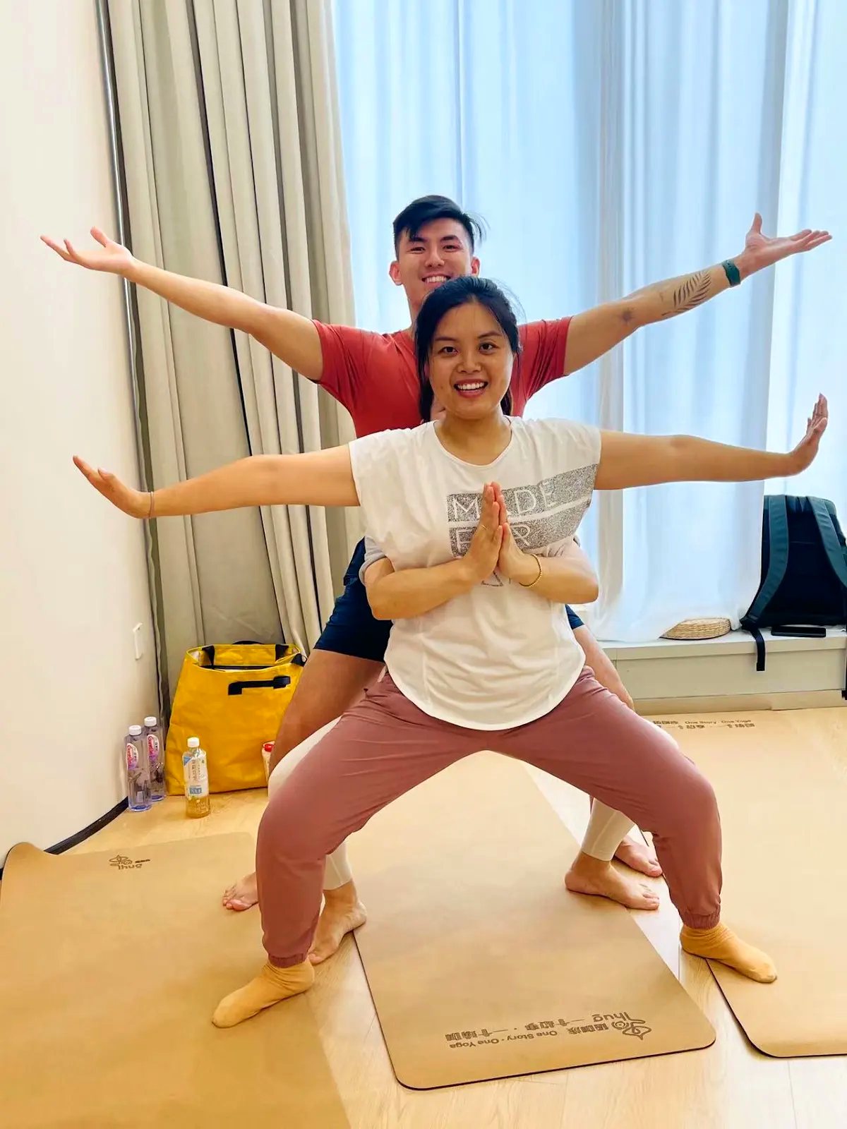 Rainbow Yoga trainees creating a human mandala together