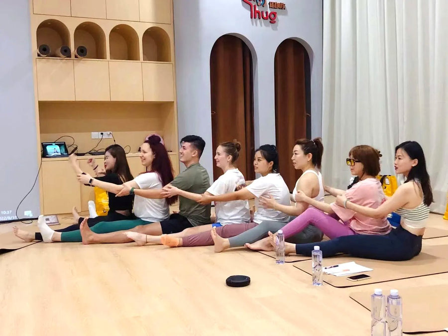 Adults practising deeper Rainbow Yoga facilitation through group movement
